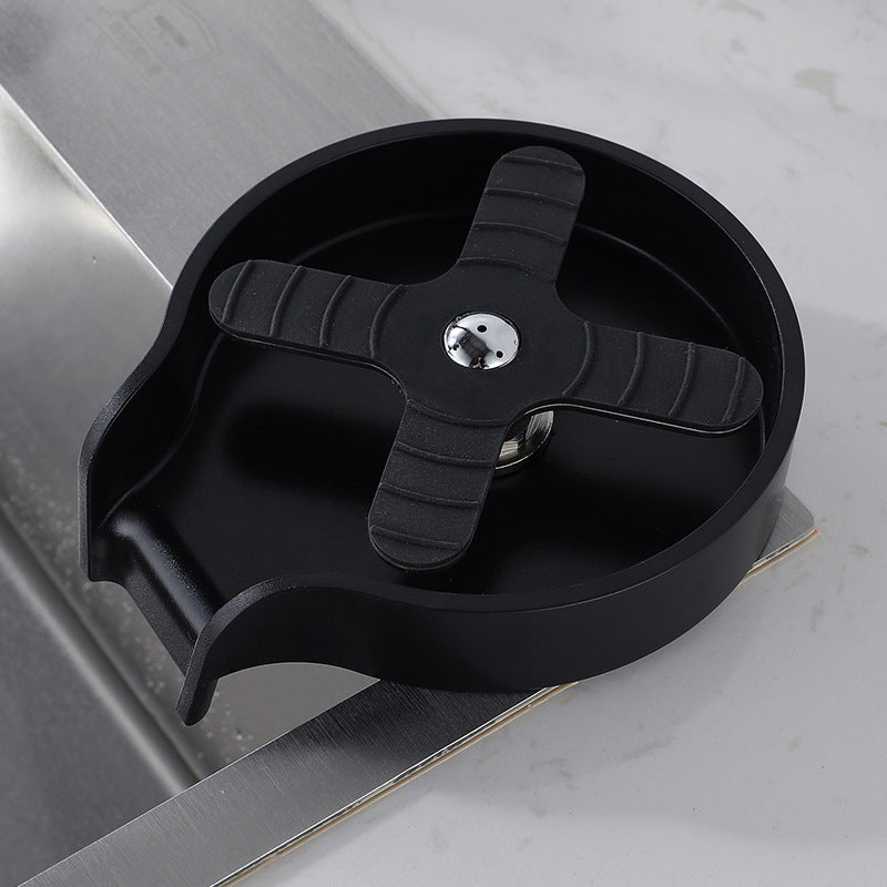 Instant Glass Rinser Homis with a black rinsing plate on a kitchen sink counter.
